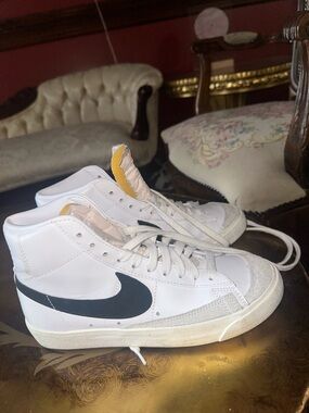 Nike Men’s White High-Top Sneakers with Black Swoosh and Yellow Tongue Detail